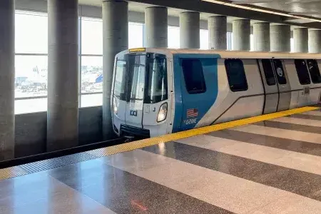 A BART train waits for passengers at the station.